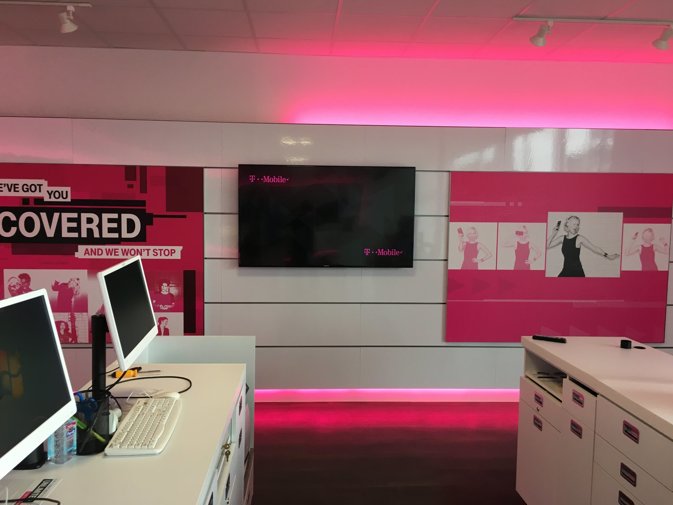 Monitor mounted on a wall in a T-Mobile store